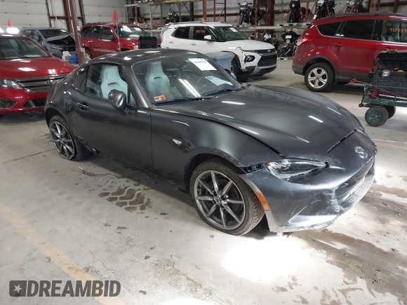2021 Mazda MX-5 Miata Grand Touring with VIN JM1NDAM73M0451484, listed as a IAAI auction lot 41485044 with 11,328 mi miles and . Bid and sale history available at DreamBid. Image 1.