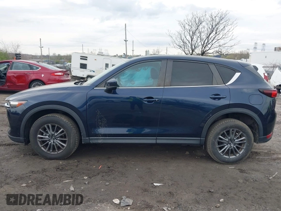 2021 Mazda CX-5 Touring with VIN JM3KFBCM1M1336457, listed as a IAAI auction lot 42034330 with 39,910 mi miles. Bid and sale history available at carsss.com. Image 13.