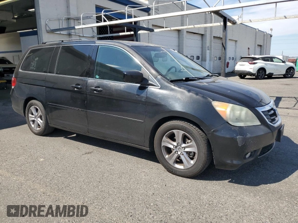 2010 Honda Odyssey Touring with VIN 5FNRL3H9XAB067890, listed as a Copart auction lot 63520575 with 213,582 mi miles and Clean title. Bid and sale history available at DreamBid. Image 4.