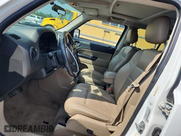 2015 Jeep Patriot High Altitude with VIN 1C4NJRFB5FD114125, listed as a Copart auction lot 62475615 with 104,438 mi miles and Salvage title. Bid and sale history available at DreamBid. Image 7.