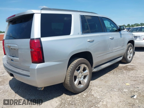 2015 Chevrolet Tahoe LT with VIN 1GNSCBKC9FR223426, listed as a IAAI auction lot 42352698 with 128,339 mi miles and . Bid and sale history available at DreamBid. Image 4.