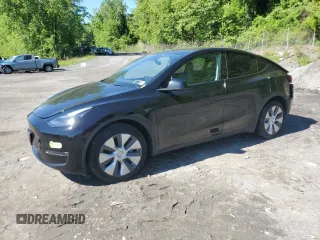 2023 Tesla Model Y Long Range z VIN 7SAYGDEE3PA181438, wystawiony jako Copart lot #57833765 z przebiegiem 18 631 mil mil oraz Szkoda całkowita • Salvage title. Historia ofert i sprzedaży dostępna na DreamBid. Obrazek 1.