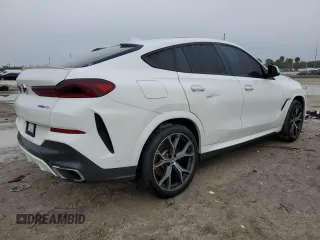 2021 BMW X6 sDrive40i z VIN 5UXCY4C08M9F34312, wystawiony jako Copart lot #87206474 z przebiegiem 67 851 mil mil oraz Czysty tytuł • Clean title. Historia ofert i sprzedaży dostępna na DreamBid. Obrazek 3.