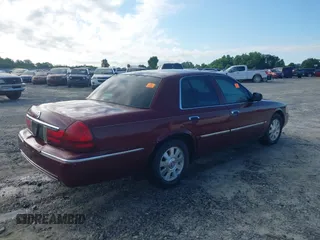 2004 Mercury Grand Marquis LS Premium z VIN 2MEFM75WX4X671041, wystawiony jako IAAI lot #42261517 z przebiegiem 107 182 mil mil oraz . Historia ofert i sprzedaży dostępna na DreamBid. Obrazek 4.