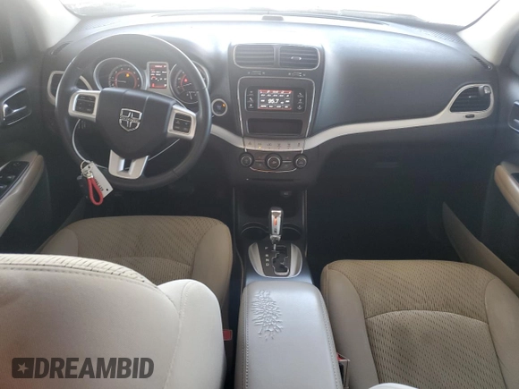 2013 Dodge Journey American Value with VIN 3C4PDCAB2DT684871, listed as a Copart auction lot 52288915 with 119,569 mi miles and Salvage title. Bid and sale history available at DreamBid. Image 8.