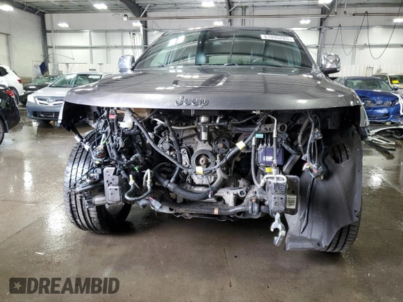 2016 Jeep Grand Cherokee Overland with VIN 1C4RJFCG9GC345309, listed as a Copart auction lot 61095285 with 115,968 mi miles and Salvage title. Bid and sale history available at DreamBid. Image 5.