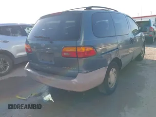 2000 Toyota Sienna LE with VIN 4T3ZF13C5YU217679, listed as a IAAI auction lot 42005053 with 198,953 mi miles. Bid and sale history available at carsss.com. Image 4.