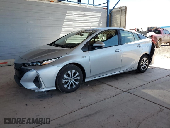 2021 Toyota Prius LE z VIN JTDKAMFP6M3183538, wystawiony jako Copart lot #54267425 z przebiegiem 29 374 mil mil oraz Szkoda całkowita • Salvage title. Historia ofert i sprzedaży dostępna na DreamBid. Obrazek 1.