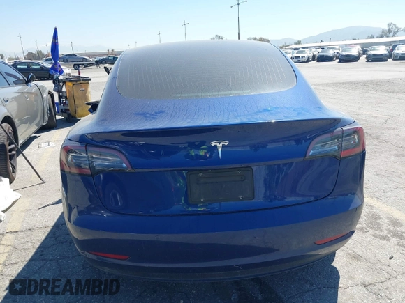 2020 Tesla Model 3 Standard Range Plus with VIN 5YJ3E1EA1LF590396, listed as a IAAI auction lot 41868089 with 51,278 mi miles. Bid and sale history available at carsss.com. Image 16.