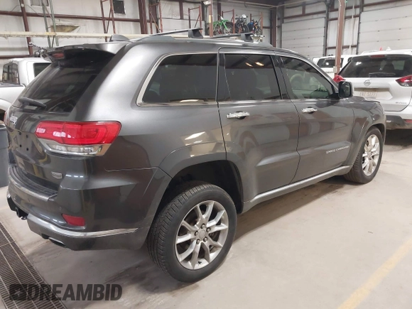 2015 Jeep Grand Cherokee Summit with VIN 1C4RJFJT6FC754799, listed as a IAAI auction lot 41699124 with 124,206 mi miles and . Bid and sale history available at DreamBid. Image 4.