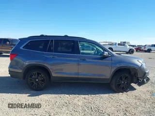 2022 Honda Pilot Special Edition with VIN 5FNYF5H27NB013972, listed as a IAAI auction lot 41219766 with 52,291 mi miles and . Bid and sale history available at carsss.com. Image 13.