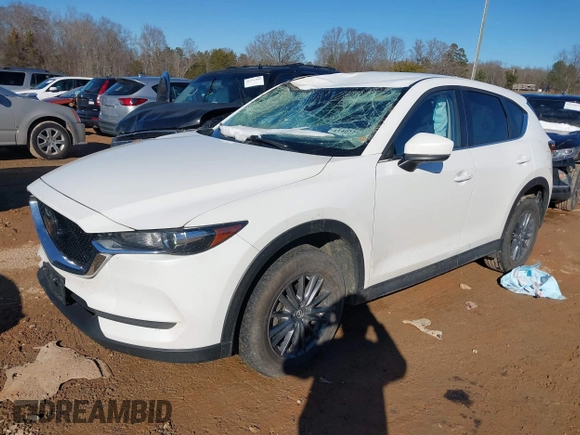 2020 Mazda CX-5 Touring with VIN JM3KFBCM0L0828207, listed as a IAAI auction lot 41305801 with 56,500 mi miles and . Bid and sale history available at DreamBid. Image 18.
