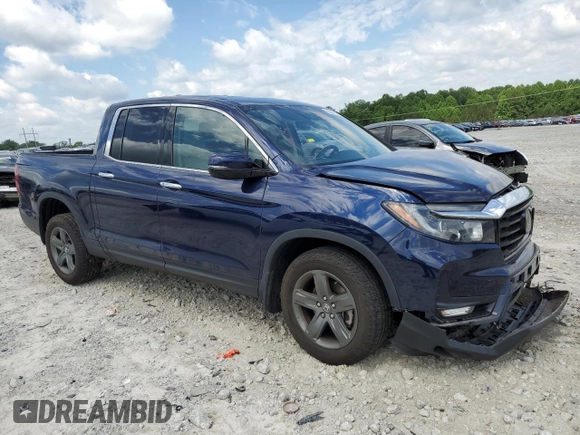 2023 Honda Ridgeline RTL-E with VIN 5FPYK3F74PB037333, listed as a Copart auction lot 56209715 with 36,041 mi miles and Salvage title. Bid and sale history available at DreamBid. Image 4.