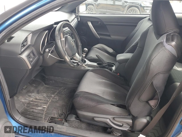 2014 Scion tC z VIN JTKJF5C76E3087992, wystawiony jako Copart lot #56058445 z przebiegiem 84 387 mil mil oraz Czysty tytuł • Clean title. Historia ofert i sprzedaży dostępna na DreamBid. Obrazek 7.