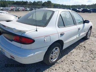 1999 Pontiac Sunfire SE z VIN 1G2JB5247X7575780, wystawiony jako IAAI lot #42143427 z przebiegiem Nie podano mil oraz . Historia ofert i sprzedaży dostępna na DreamBid. Obrazek 4.