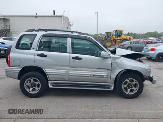 2001 Chevrolet Tracker LT z VIN 2CNBJ634916959876, wystawiony jako IAAI lot #42166992 z przebiegiem 97 878 mil mil oraz . Historia ofert i sprzedaży dostępna na DreamBid. Obrazek 14.