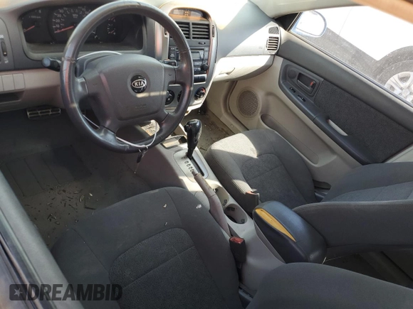 2005 Kia Spectra with VIN KNAFE161555082073, listed as a Copart auction lot 77062804 with 173,387 mi miles and Salvage Title. Bid and sale history available at DreamBid. Image 7.