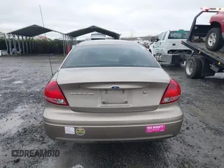 2006 Ford Taurus SE z VIN 1FAFP53U26A197294, wystawiony jako IAAI lot #41506334 z przebiegiem 180 411 mil mil oraz . Historia ofert i sprzedaży dostępna na DreamBid. Obrazek 16.