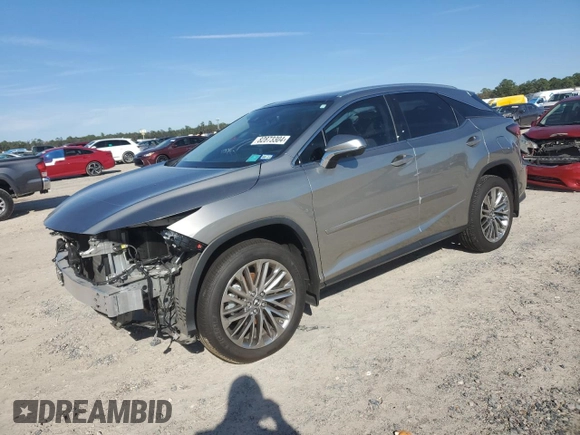 2022 Lexus RX with VIN 2T2JZMAA8NC256470, listed as a Copart auction lot 82873304 with 14,614 mi miles and Salvage Title. Bid and sale history available at carsss.com. Image 1.
