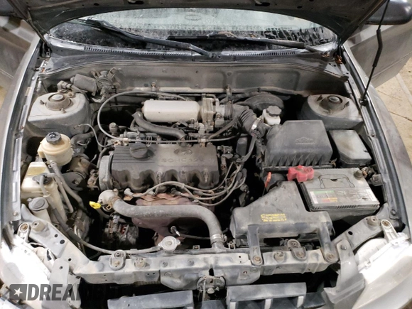 2000 Hyundai Accent z VIN KMHCG45G4YU090520, wystawiony jako Copart lot #79705864 z przebiegiem 145 490 mil mil oraz Szkoda całkowita • Salvage title. Historia ofert i sprzedaży dostępna na DreamBid. Obrazek 11.