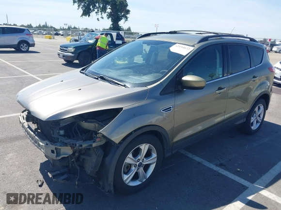 2013 Ford Escape SE with VIN 1FMCU0G99DUC05901, listed as a IAAI auction lot 42194672 with 121,435 mi miles and . Bid and sale history available at DreamBid. Image 2.
