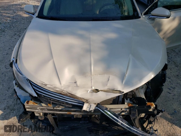 2015 Lincoln MKZ z VIN 3LN6L2JK4FR629312, wystawiony jako Copart lot #60230405 z przebiegiem 79 570 mil mil oraz Szkoda całkowita • Salvage title. Historia ofert i sprzedaży dostępna na DreamBid. Obrazek 11.