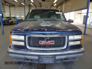 1999 GMC Suburban z VIN 3GKFK16R5XG525338, wystawiony jako Copart lot #58920565 z przebiegiem 212 586 mil mil oraz Szkody całkowita. Historia ofert i sprzedaży dostępna na DreamBid. Obrazek 5.
