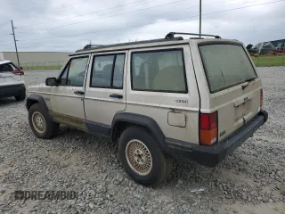 1995 Jeep Cherokee Sport with VIN 1J4FJ68S4SL618773, listed as a Copart auction lot 74126954 with 318,519 mi miles and Salvage title. Bid and sale history available at DreamBid. Image 2.