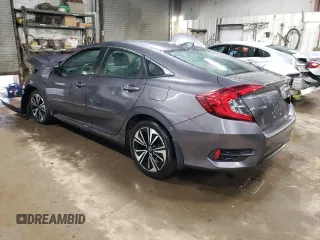 2018 Honda Civic EX-T with VIN 19XFC1F42JE000270, listed as a Copart auction lot 46618665 with 54,321 mi miles and Salvage title. Bid and sale history available at DreamBid. Image 2.
