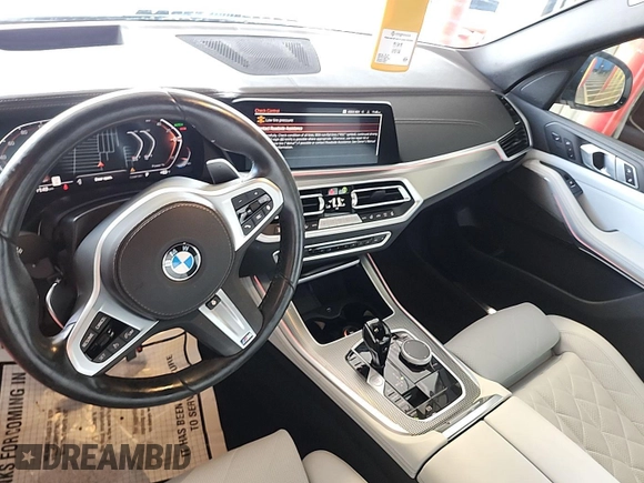2023 BMW X5 xDrive40i with VIN 5UXCR6C00P9R65110, listed as a IAAI auction lot 42635441 with 32,227 mi miles and . Bid and sale history available at DreamBid. Image 2.