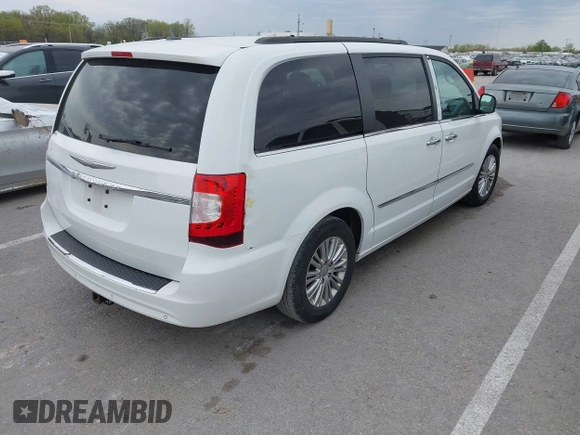 2015 Chrysler Town & Country Touring-L with VIN 2C4RC1CG9FR573863, listed as a IAAI auction lot 42036034 with 141,390 mi miles. Bid and sale history available at carsss.com. Image 4.
