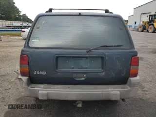 1995 Jeep Grand Cherokee Laredo with VIN 1J4FX58S0SC726476, listed as a Copart auction lot 69608784 with 264,705 mi miles and Salvage Title. Bid and sale history available at carsss.com. Image 6.