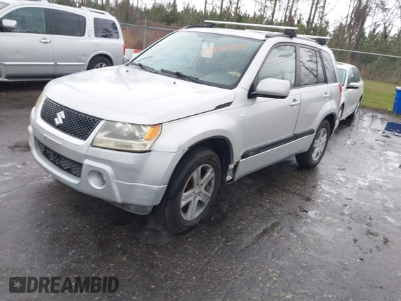 2006 Suzuki Grand Vitara Luxury z VIN JS3TE947964103091, wystawiony jako IAAI lot #41658953 z przebiegiem 221 696 mil mil oraz . Historia ofert i sprzedaży dostępna na DreamBid. Obrazek 2.