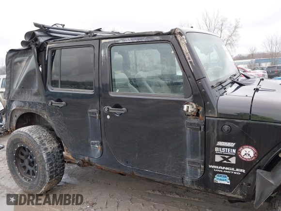 2008 Jeep Wrangler Unlimited X with VIN 1J4GA39138L641138, listed as a IAAI auction lot 41986230 with 215,026 mi miles. Bid and sale history available at carsss.com. Image 14.