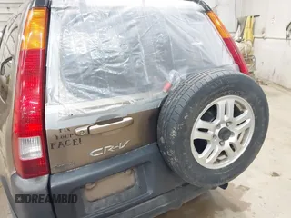 2004 Honda CR-V EX with VIN JHLRD78814C057877, listed as a IAAI auction lot 42065687 with 220,207 mi miles and . Bid and sale history available at carsss.com. Image 6.