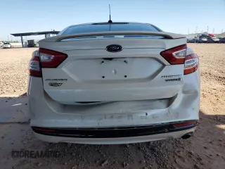2013 Ford Fusion Titanium Hybrid z VIN 3FA6P0RUXDR376633, wystawiony jako Copart lot #57685555 z przebiegiem 133 248 mil mil oraz Szkoda całkowita • Salvage title. Historia ofert i sprzedaży dostępna na DreamBid. Obrazek 6.