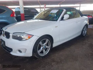 2013 BMW 1 Series 128i with VIN WBAUN1C55DVR01404, listed as a IAAI auction lot 41682695 with 100,948 mi miles. Bid and sale history available at carsss.com. Image 2.