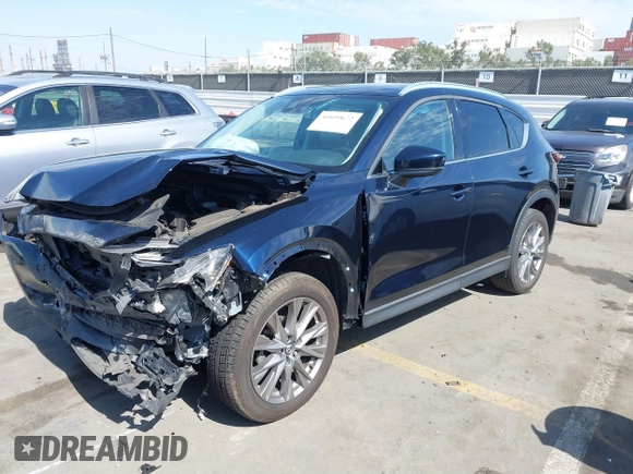 2020 Mazda CX-5 Grand Touring with VIN JM3KFADM6L1830093, listed as a IAAI auction lot 41699672 with 66,769 mi miles. Bid and sale history available at carsss.com. Image 19.