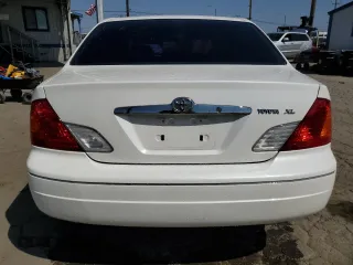 2000 Toyota Avalon XL with VIN 4T1BF28B9YU068001, listed as a Copart auction lot 54958915 with 240,232 mi miles and Salvage Title. Bid and sale history available at DreamBid. Image 6.