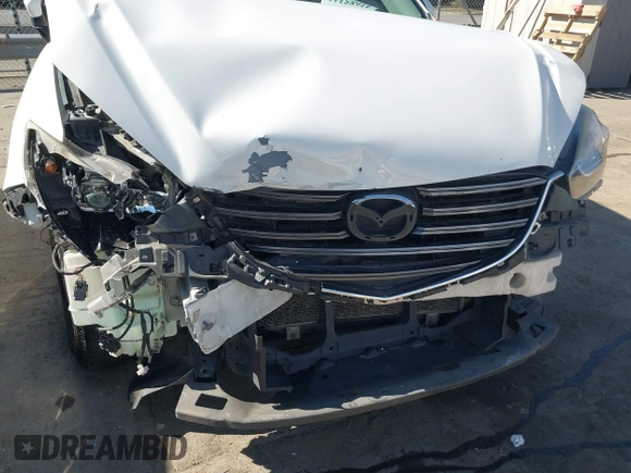 2016 Mazda CX-5 Sport with VIN JM3KE2BY9G0890587, listed as a IAAI auction lot 41685344 with 91,190 mi miles. Bid and sale history available at carsss.com. Image 10.