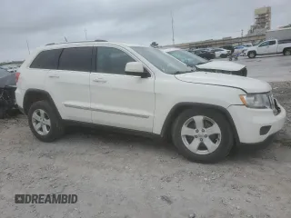 2012 Jeep Grand Cherokee Laredo with VIN 1C4RJEAG3CC259758, listed as a Copart auction lot 51514765 with 196,189 mi miles and Salvage Title. Bid and sale history available at carsss.com. Image 4.