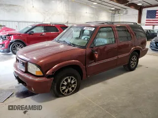 1998 GMC Jimmy SLT z VIN 1GKDT13W9W2953273, wystawiony jako Copart lot #59024095 z przebiegiem 292 332 mil mil oraz Nie do naprawy • Non repairable. Historia ofert i sprzedaży dostępna na DreamBid. Obrazek 1.