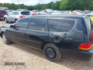1996 Toyota Camry LE z VIN 4T1EF12K9TU117514, wystawiony jako IAAI lot #42241880 z przebiegiem 192 764 mil mil oraz . Historia ofert i sprzedaży dostępna na DreamBid. Obrazek 14.