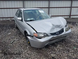 2001 Mazda Protege LX with VIN JM1BJ226910475036, listed as a IAAI auction lot 41428483 with 155,732 mi miles and . Bid and sale history available at carsss.com. Image 1.