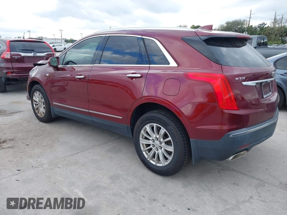 2017 Cadillac XT5 FWD with VIN 1GYKNARS2HZ107587, listed as a IAAI auction lot 41614842 with 124,611 mi miles and . Bid and sale history available at carsss.com. Image 3.