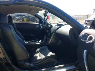 2004 Nissan 350Z Touring with VIN JN1AZ34D94M102990, listed as a IAAI auction lot 41830661 with 107,520 mi miles. Bid and sale history available at carsss.com. Image 5.