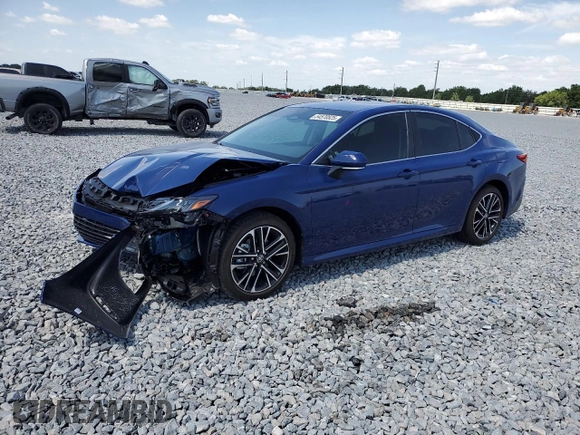 2025 Toyota Camry LE with VIN 4T1DAACK0SU075581, listed as a Copart auction lot 54570525 with 2,329 mi miles and Non Repairable. Bid and sale history available at DreamBid. Image 1.