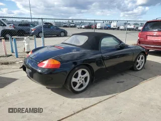 2000 Porsche Boxster z VIN WP0CA2988YU627807, wystawiony jako Copart lot #45522955 z przebiegiem 120 384 mil mil oraz Szkody całkowita. Historia ofert i sprzedaży dostępna na DreamBid. Obrazek 3.
