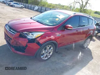 2014 Ford Escape Titanium with VIN 1FMCU0J91EUE12034, listed as a IAAI auction lot 42027493 with 160,417 mi miles and . Bid and sale history available at DreamBid. Image 2.
