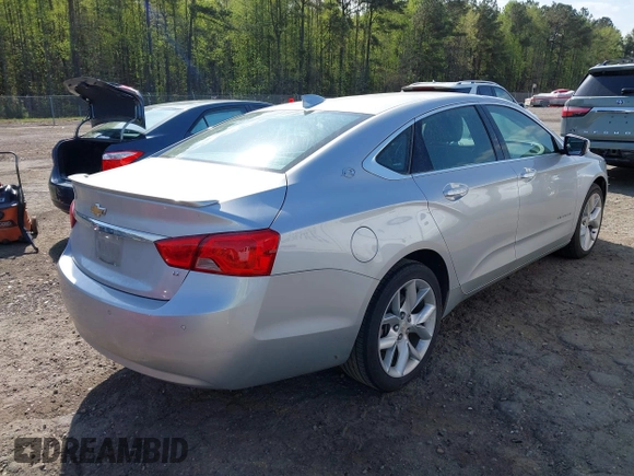 2015 Chevrolet Impala LT with VIN 2G1125S35F9213472, listed as a IAAI auction lot 41924702 with 124,656 mi miles and . Bid and sale history available at DreamBid. Image 4.